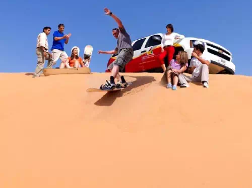 Dubai Small Group Sunset Desert Ride with Henna, Sandboarding and Fire Show