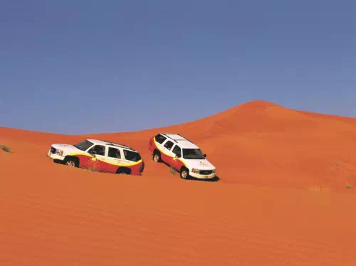 Dubai Small Group Sunset Desert Ride with Henna, Sandboarding and Fire Show