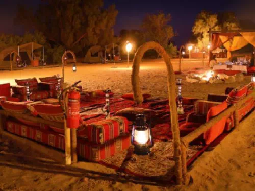 Dubai Overnight Desert Safari Tour with Camel Ride and BBQ Dinner