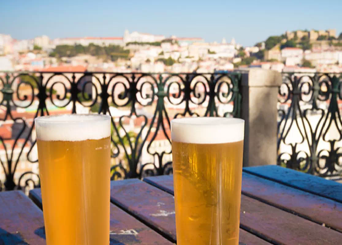 Lisbon Walking Tour with Traditional Snacks, Wine, and Ferry Ride