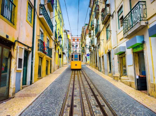 Lisbon Walking Tour with Traditional Snacks, Wine, and Ferry Ride
