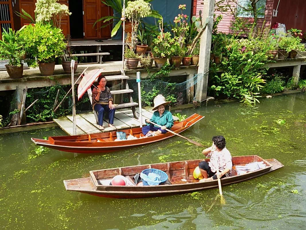 Bangkok Floating Market Bike Tour with Long-tail Boat Ride and Temple Visits