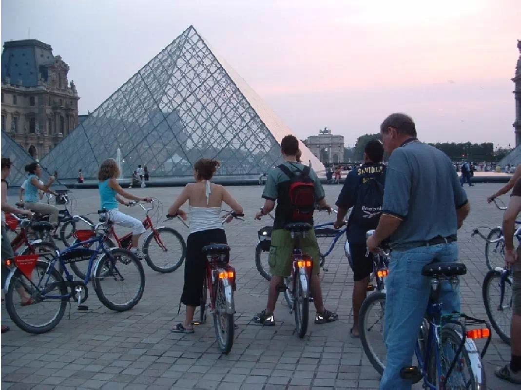 Paris Night Guided Bike Tour with River Seine Sightseeing Cruise Ticket